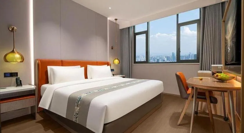 Bed in PAI Hotel·Chengdu Jintang Huaikou Huaizhou Avenue