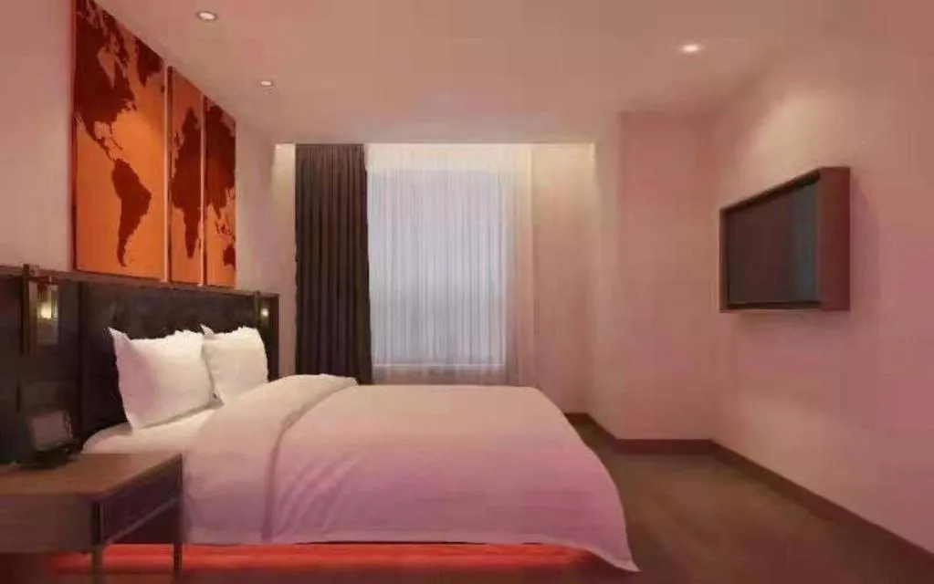 Bed in James Joyce Coffetel Zhengzhou CBD Exhibition Center Provincial People's Hospital