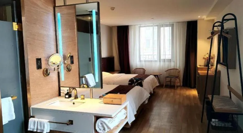 Bed in James Joyce Coffetel Zhengzhou CBD Exhibition Center Provincial People's Hospital