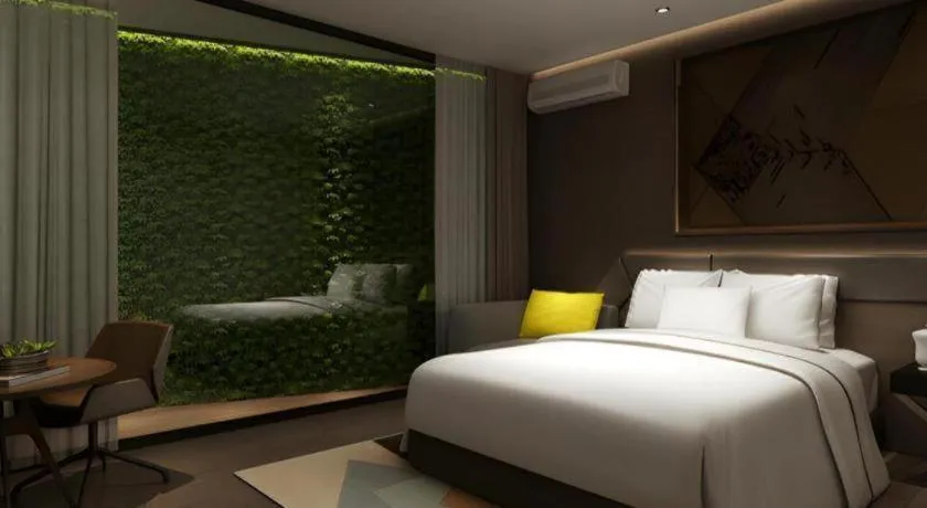 Bed in IU Hotel Qingdao Golden Beach Xuejiadao Metro Station