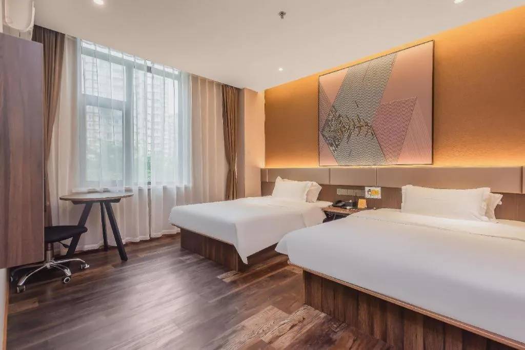 Bed in IU Hotel Qingdao Golden Beach Xuejiadao Metro Station