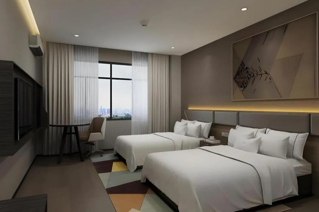 Bed in IU Hotel Qingdao Golden Beach Xuejiadao Metro Station