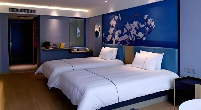 Bed in Magnotel Hotel Anshun West High-Speed Railway Station