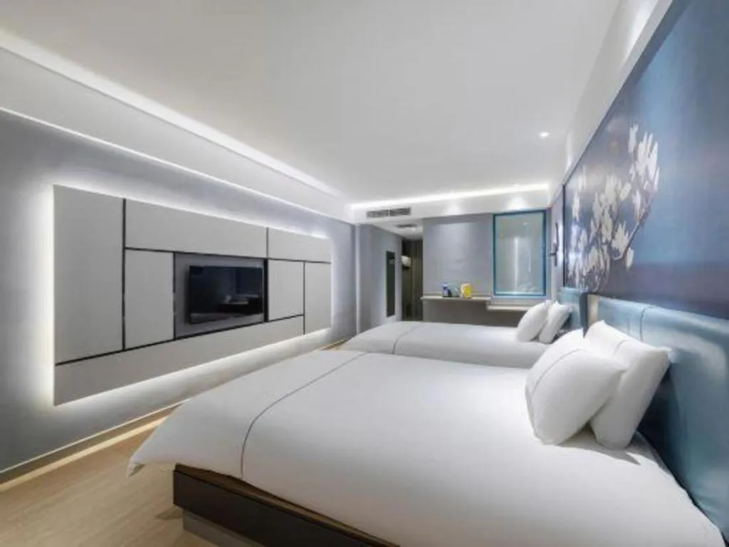 Bed in Magnotel Hotel Anshun West High-Speed Railway Station