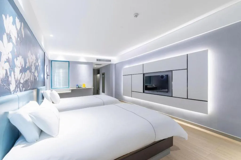 Bed in Magnotel Hotel Anshun West High-Speed Railway Station