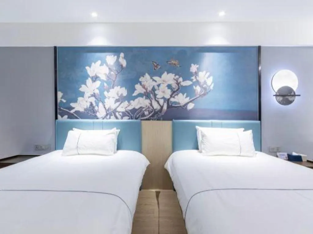 Bed in Magnotel Hotel Anshun West High-Speed Railway Station
