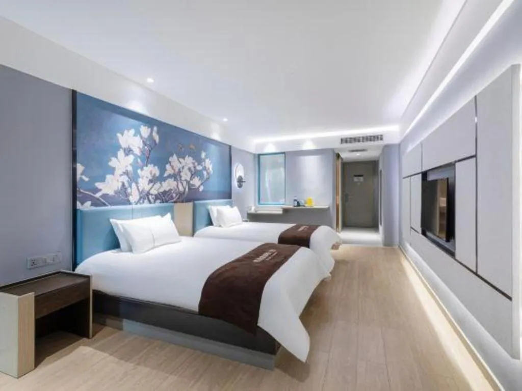 Bed in Magnotel Hotel Anshun West High-Speed Railway Station
