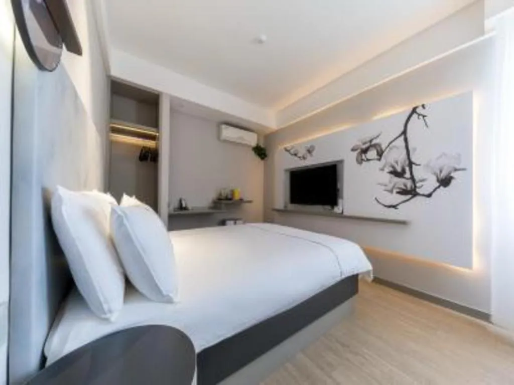 Bed in Magnotel Hotel Suzhou Guanqian Street Pingjiang Road