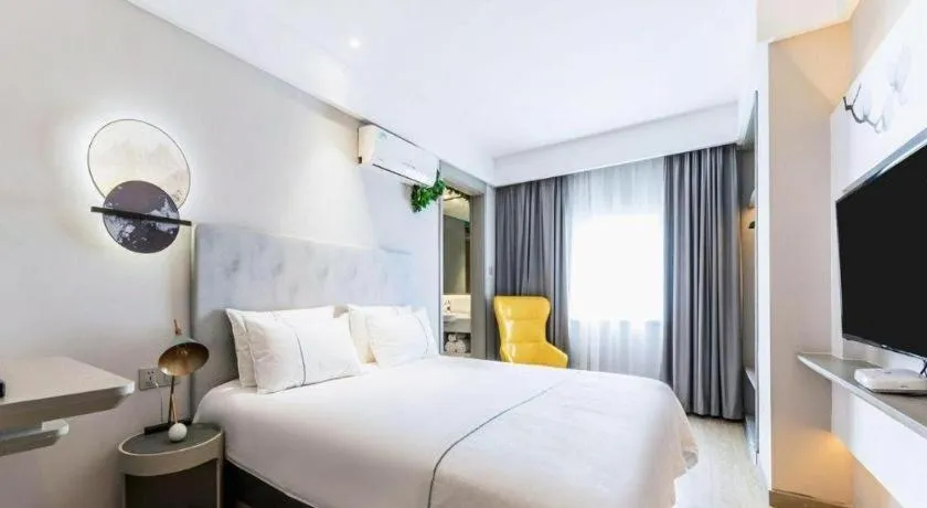 Bed in Magnotel Hotel Suzhou Guanqian Street Pingjiang Road