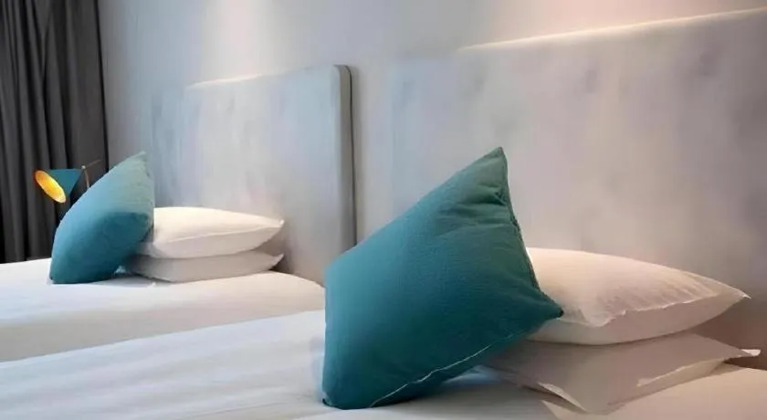 Bed in Magnotel Hotel Suzhou Guanqian Street Pingjiang Road