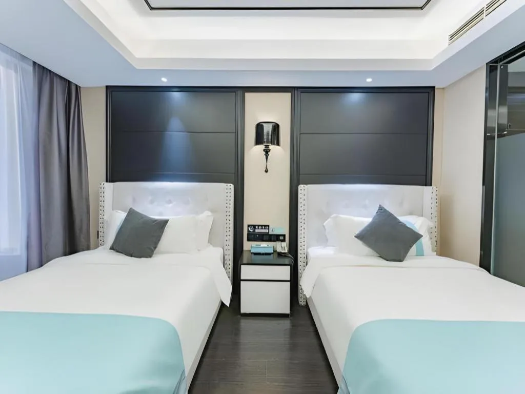 Bed in Xana Hotelle Zhengzhou North Passenger Terminal North University Town