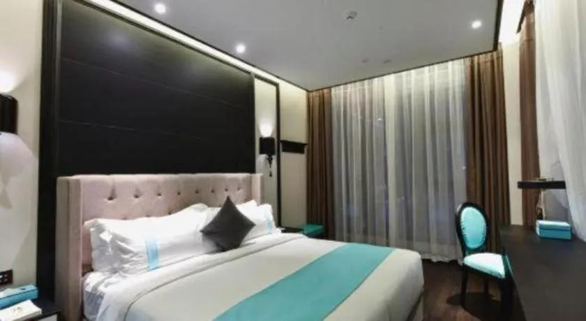 Bed in Xana Hotelle Chengdou Xindu Sanhechang Metro Station