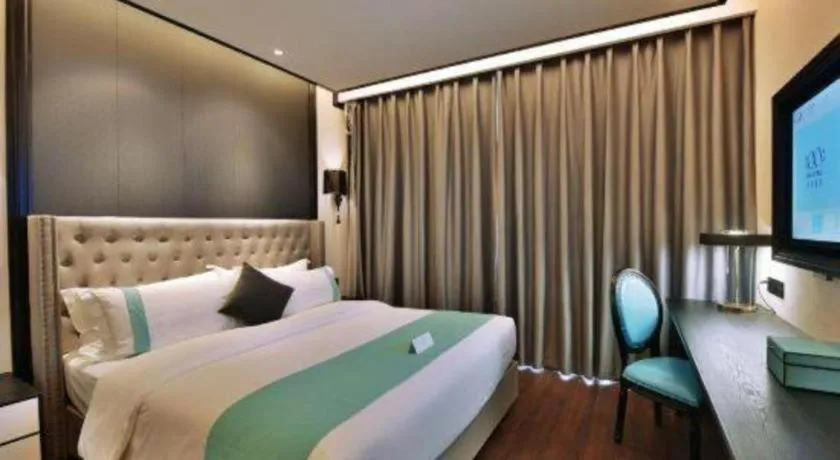 Bed in Xana Hotelle Chengdou Xindu Sanhechang Metro Station