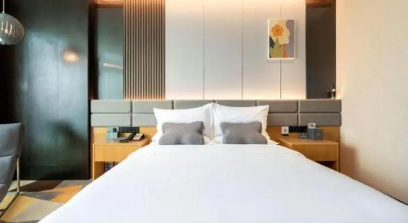 Bed in Chonpines Hotel Guangzhou Sunac Cultural and Tourism City Shiling