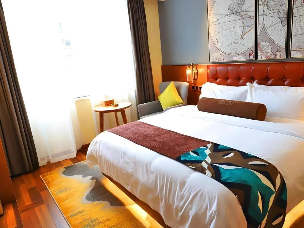 Bed in James Joyce Coffetel Guangyuan High-Speed Railway Station Dongba Municipal Government