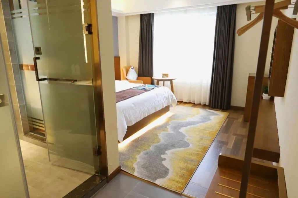 Bed in James Joyce Coffetel Guangyuan High-Speed Railway Station Dongba Municipal Government