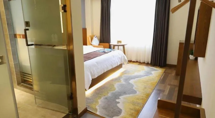 Bed in James Joyce Coffetel Guangyuan High-Speed Railway Station Dongba Municipal Government