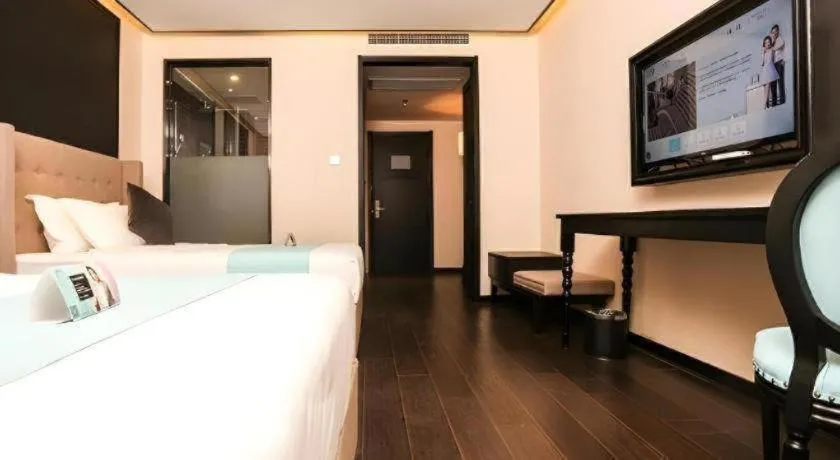 Bed in Xana Hotelle·Ji'nan Hi-tech Zone Century Avenue Tangye