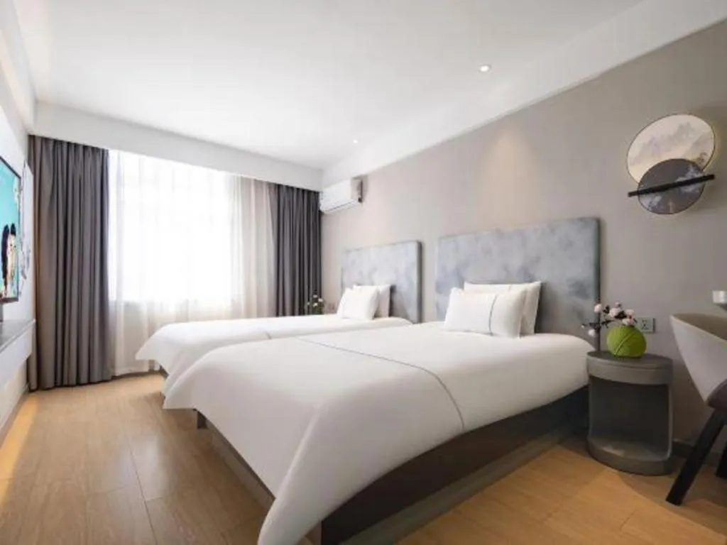 Bed in Magnotel Hotel Dandong Railway Yalv River