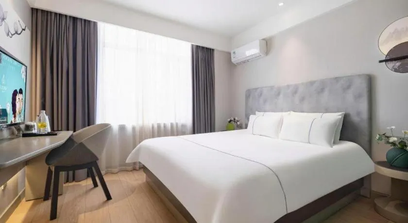 Bed in Magnotel Hotel Dandong Railway Yalv River