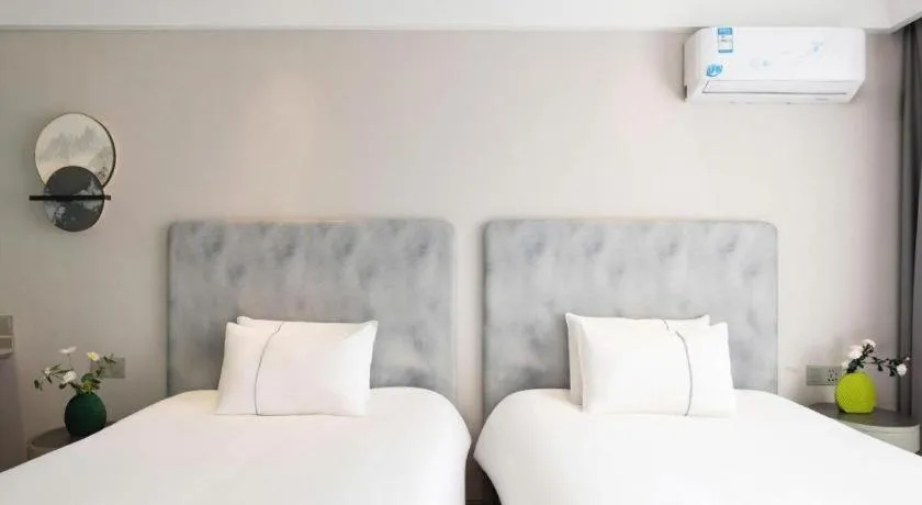 Bed in Magnotel Hotel Dandong Railway Yalv River