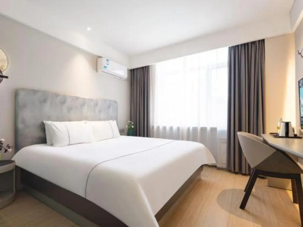 Bed in Magnotel Hotel Dandong Railway Yalv River