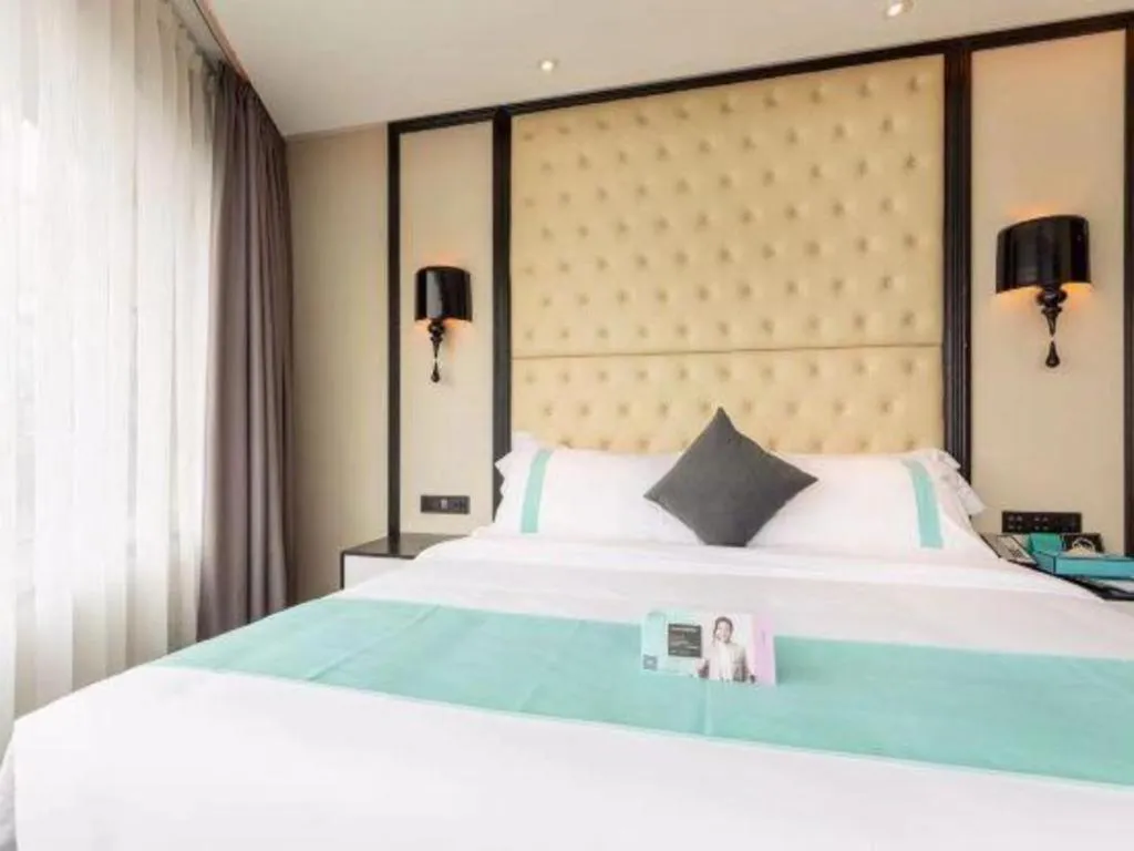 Bed in Xana Hotelle·Guangzhou Shangxiajiu Yongqingfang Changshou Road Metro Station