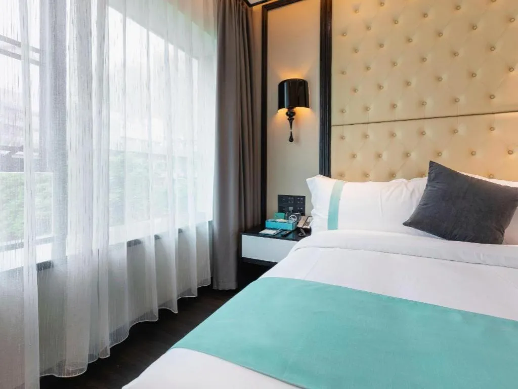 Bed in Xana Hotelle·Guangzhou Shangxiajiu Yongqingfang Changshou Road Metro Station