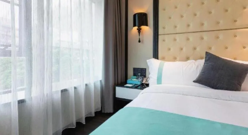 Bed in Xana Hotelle·Guangzhou Shangxiajiu Yongqingfang Changshou Road Metro Station