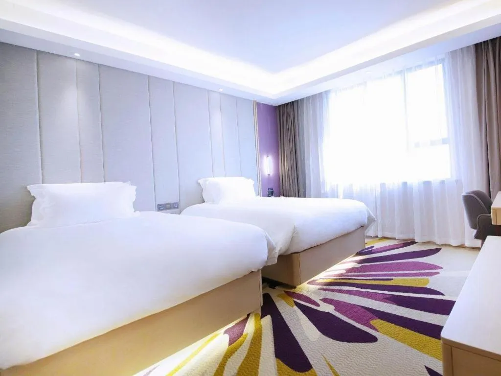 Bed in Lavande Hotel·Heyuan Bavaria