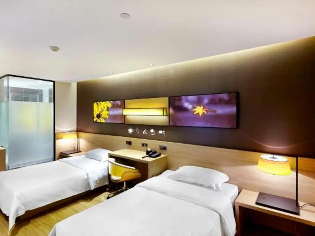Bed in IU Hotel·Tianjin Binhai New District Yanghuo Market