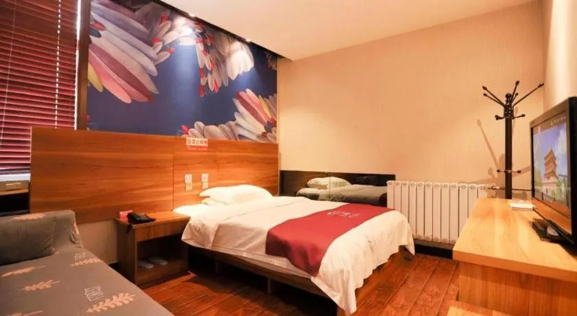 Bed in PAI Hotel Huayin Huashan Mountain Scenic Spot Ancient Street