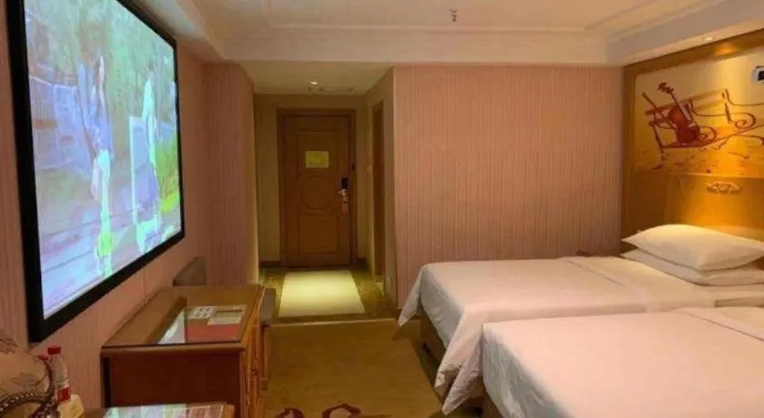 Bed in Vienna Hotel Inner Mongolia Hohhot Railway Station Gongzhufu Metro Station