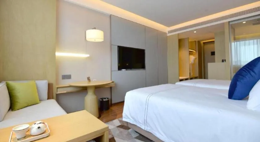 Bed in AUGUSTINE HOTEL