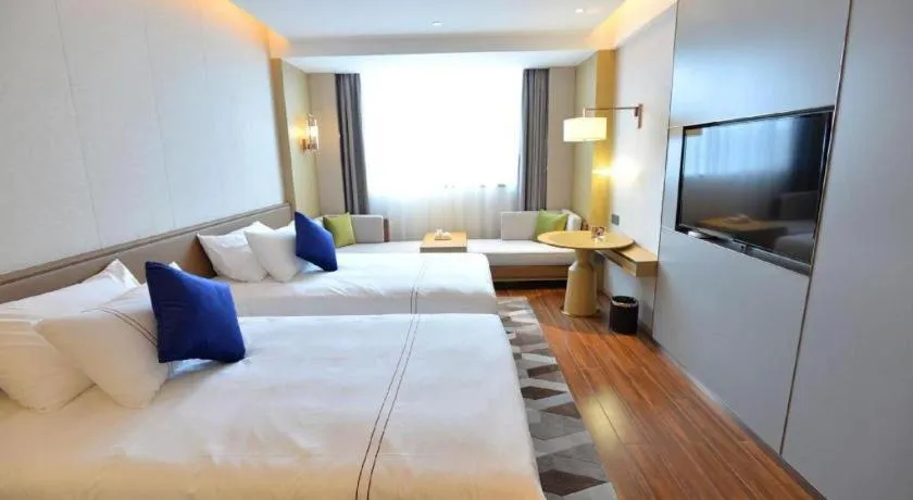 Bed in AUGUSTINE HOTEL