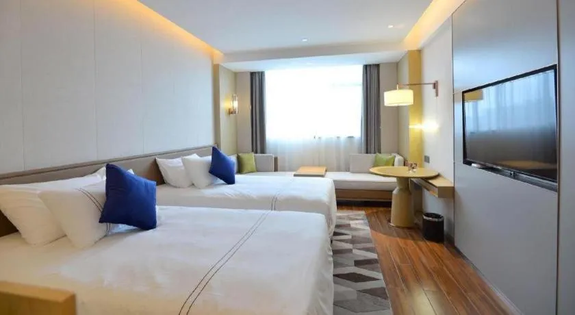 Bed in AUGUSTINE HOTEL