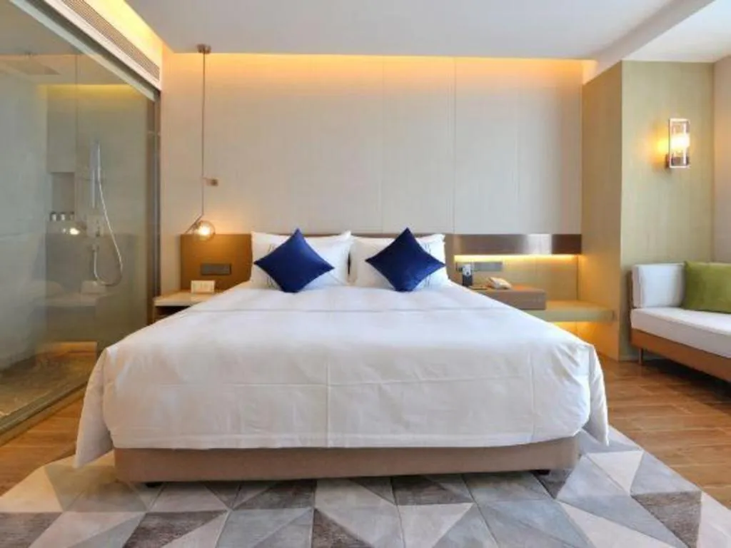 Bed in AUGUSTINE HOTEL