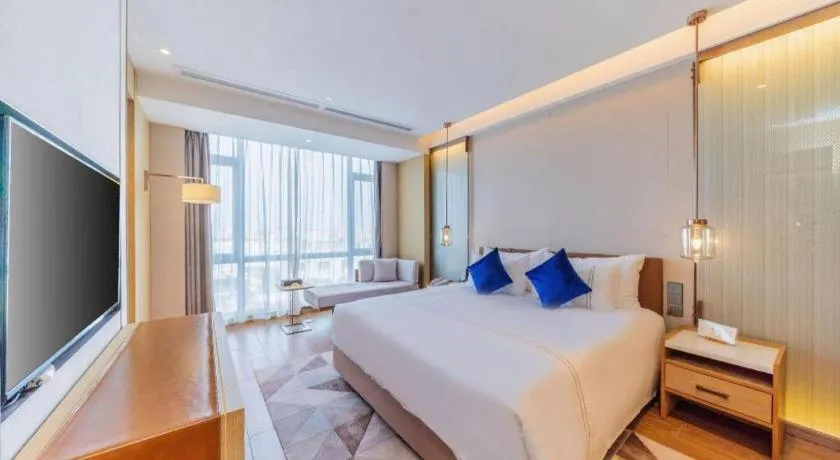 Bed in AUGUSTINE HOTEL