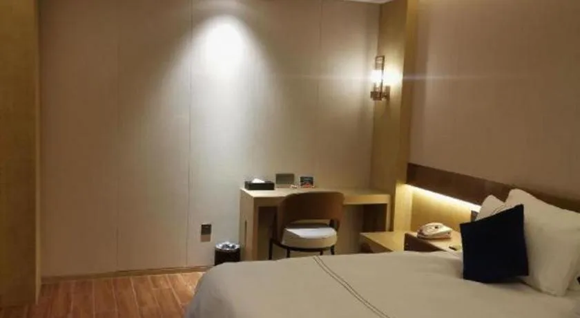 Bed in AUGUSTINE HOTEL