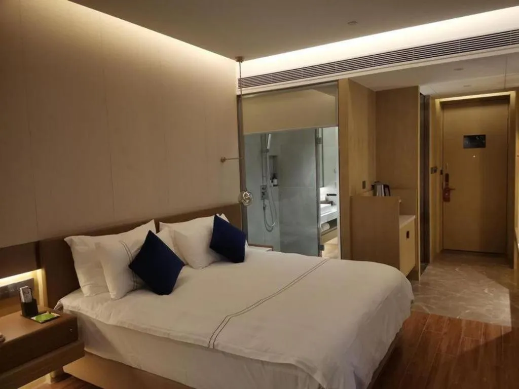 Bed in AUGUSTINE HOTEL