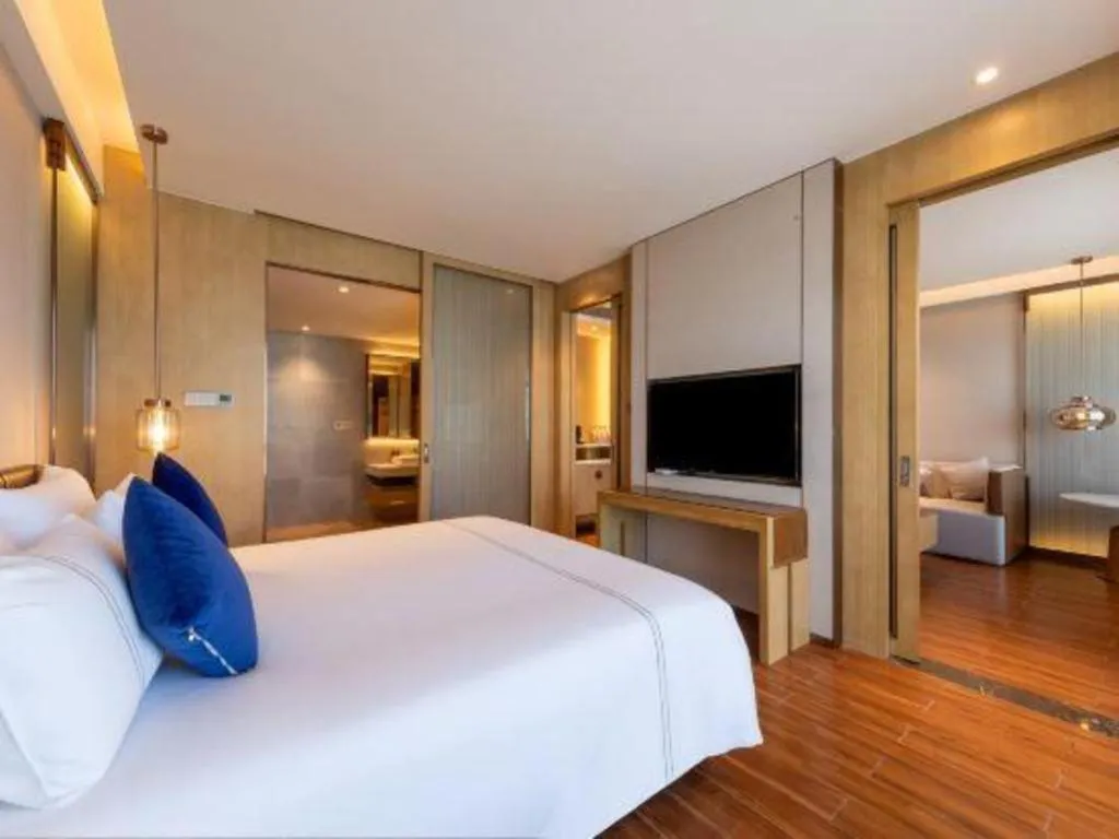 Bed in AUGUSTINE HOTEL