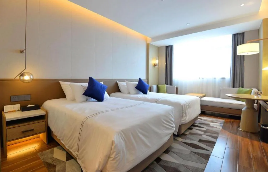 Bed in AUGUSTINE HOTEL