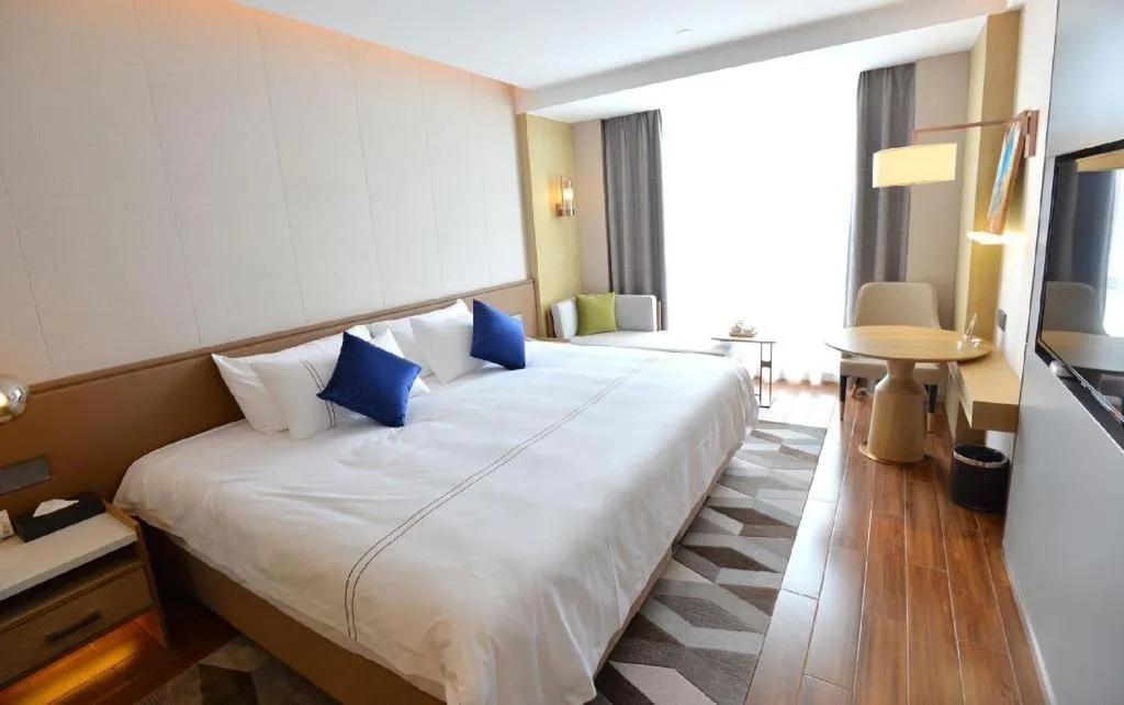 Bed in AUGUSTINE HOTEL