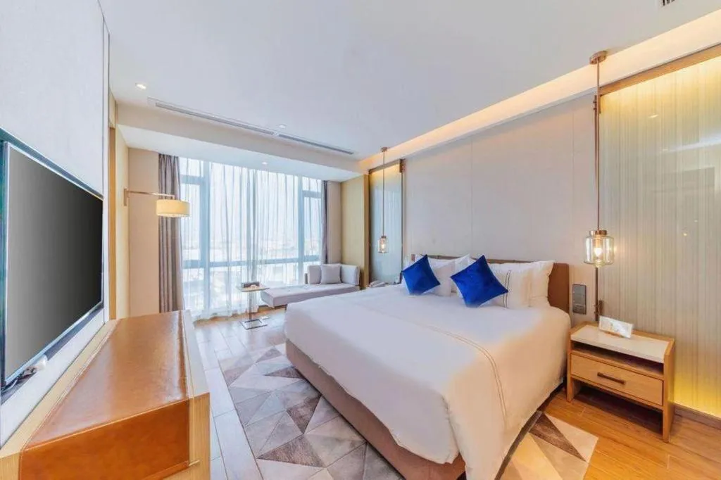 Bed in AUGUSTINE HOTEL