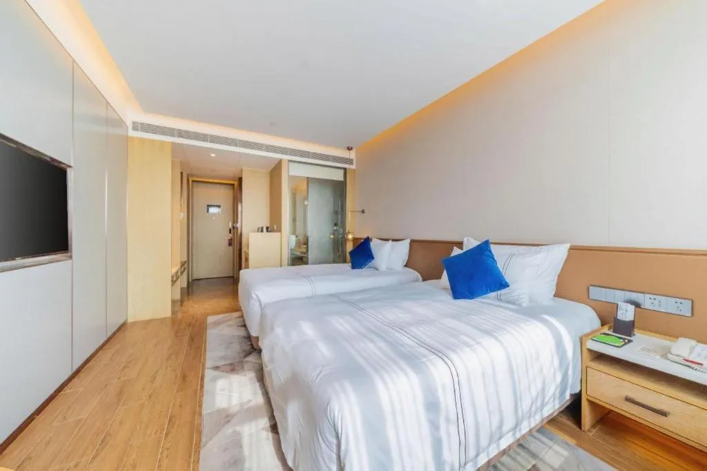 Bed in AUGUSTINE HOTEL