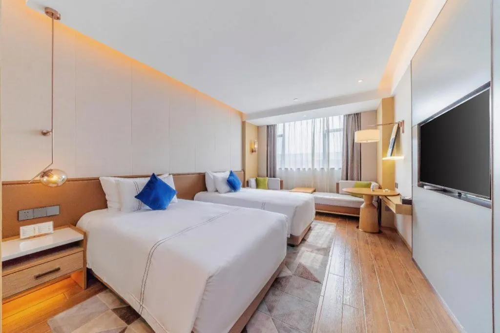 Bed in AUGUSTINE HOTEL