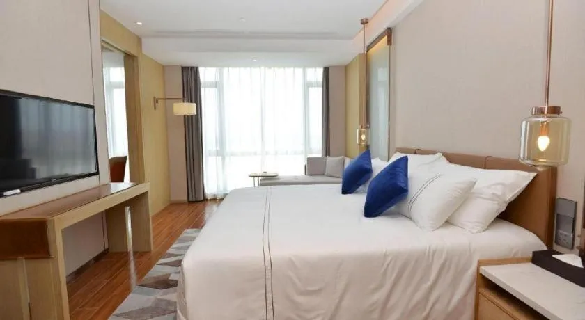 Bed in AUGUSTINE HOTEL