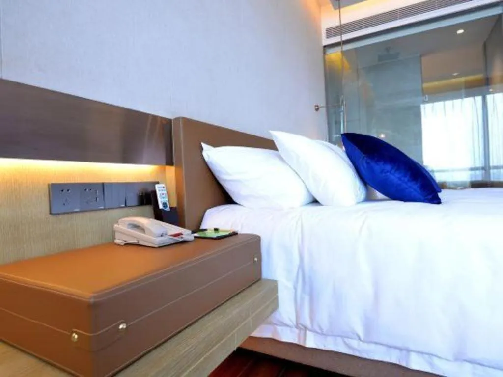 Bed in AUGUSTINE HOTEL