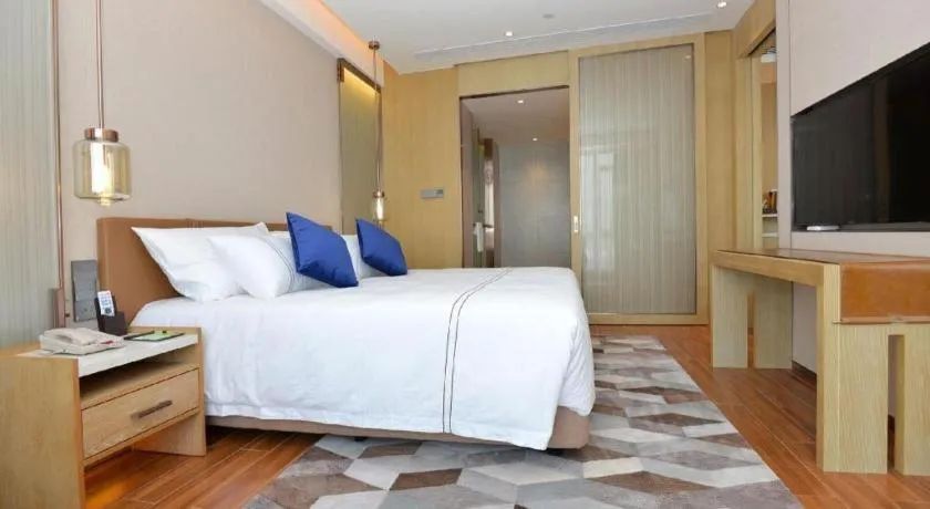 Bed in AUGUSTINE HOTEL