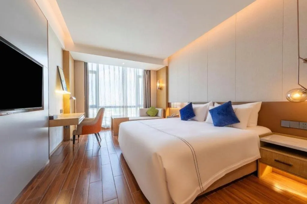 Bed in AUGUSTINE HOTEL